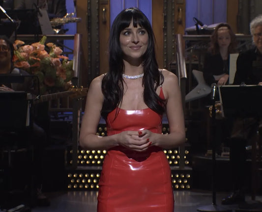 Close view of Dakota Johnson in a red dress wearing her sparkling diamond collar necklace during Saturday Night Live on October 3, 2026