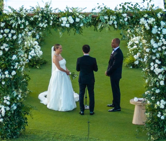 Jennifer Meyer in a strapless white gown facing Geoffrey Ogunlesi at their October 10, 2026 wedding ceremony in Lānaʻi, Hawaii