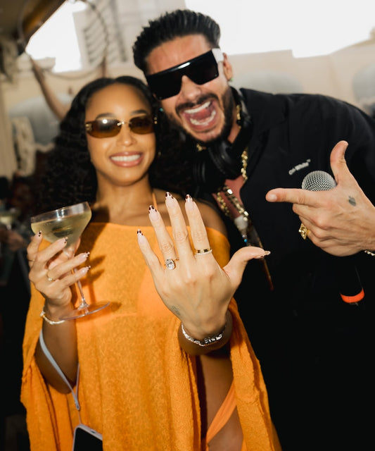 Nikki Hall proudly showing her engagement ring beside DJ Pauly D after their September 27, 2026 proposal in Las Vegas
