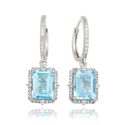 Suzy Levian Sterling Silver Emerald Cut Blue Topaz & White Topaz Halo Dangling Earrings