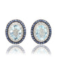 Suzy Levian Sterling Silver Oval Cut Blue Topaz And Sapphire Accent Stud Earrings